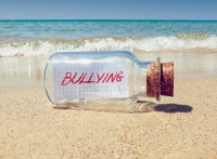 bullying message in bottle shutterstock 208955578 300x227