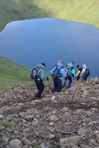 allmode hikers with lake snap